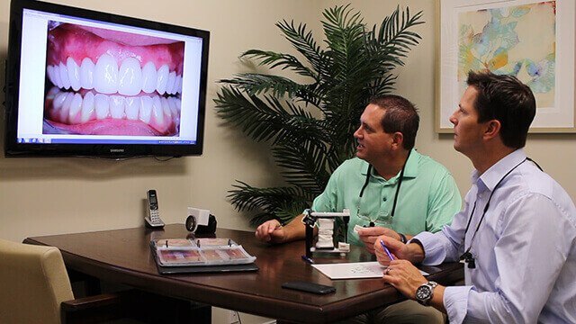 Juno Beach Smiles dentists Dr. Riley and Dr. Keuning working