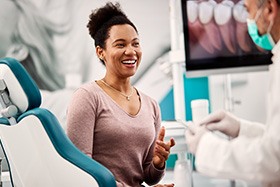 Dentist and female patient discussing cost of teeth whitening in Juno Beach