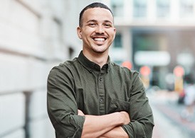 Smiling man outside office building