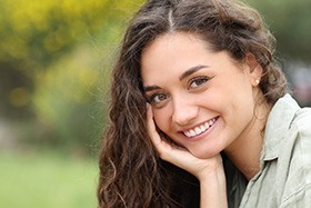 Woman smiling with whiter, brighter teeth 