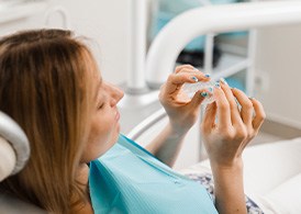 Patient looking at clear aligner